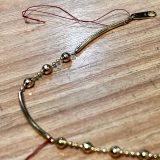 切れたネックレス修理